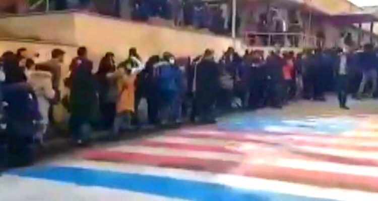 WATCH Iranian protestors refuse to trample US-Israel flags